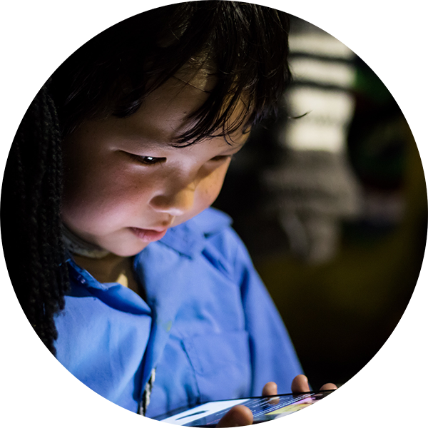 child looking into phone